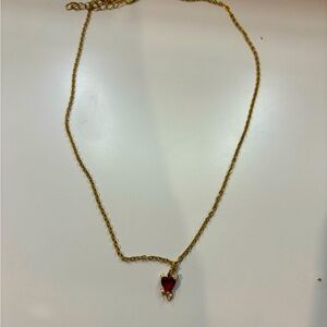 Gold necklace with heart pendant